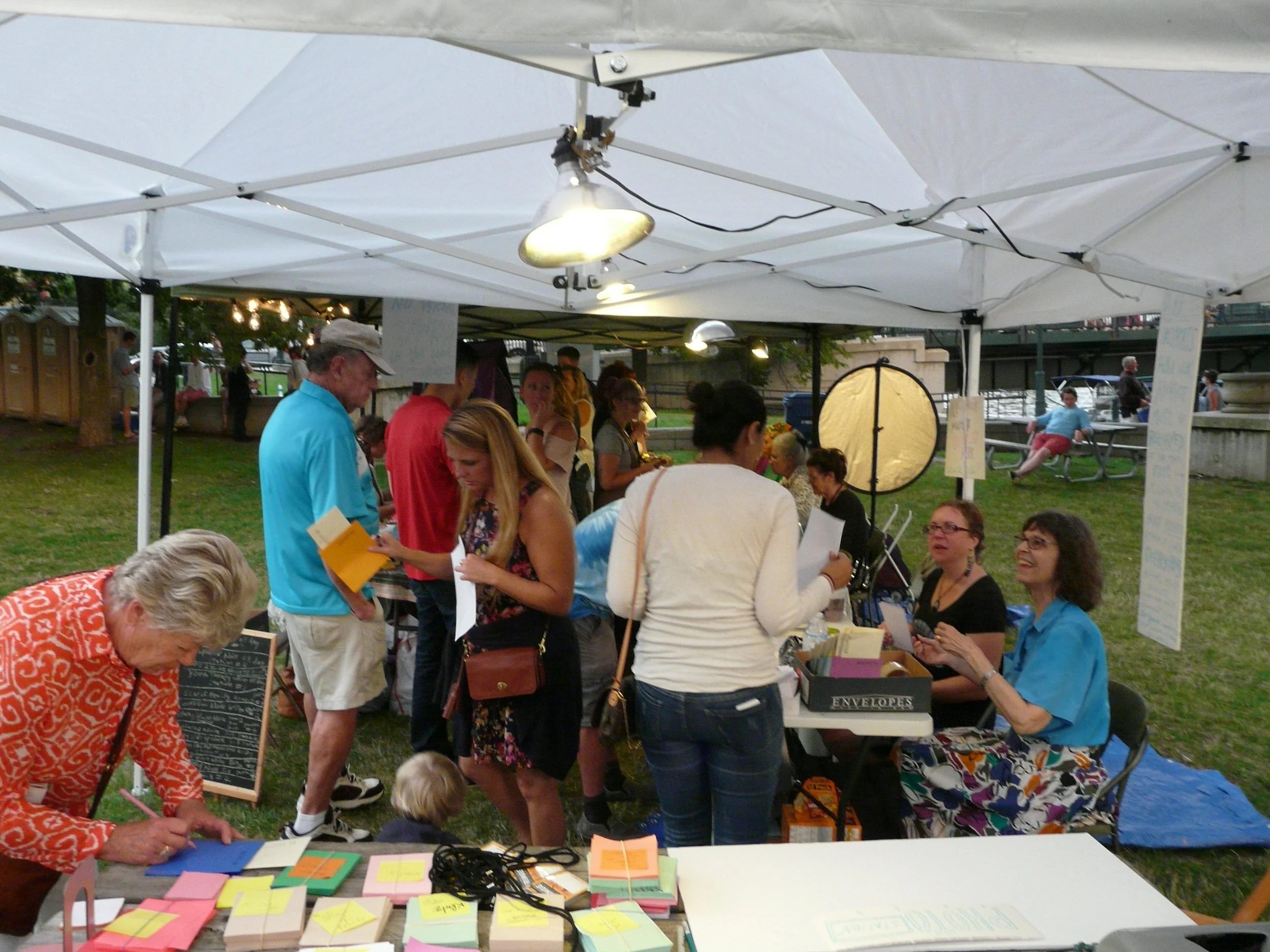 Volunteers at the entrance would help participants select one question to receive advice on. The question would then be written down on the cover of each participants issued "advice passport" so they could show their question to each advisor without breaking the "no talking in the tent" rule.