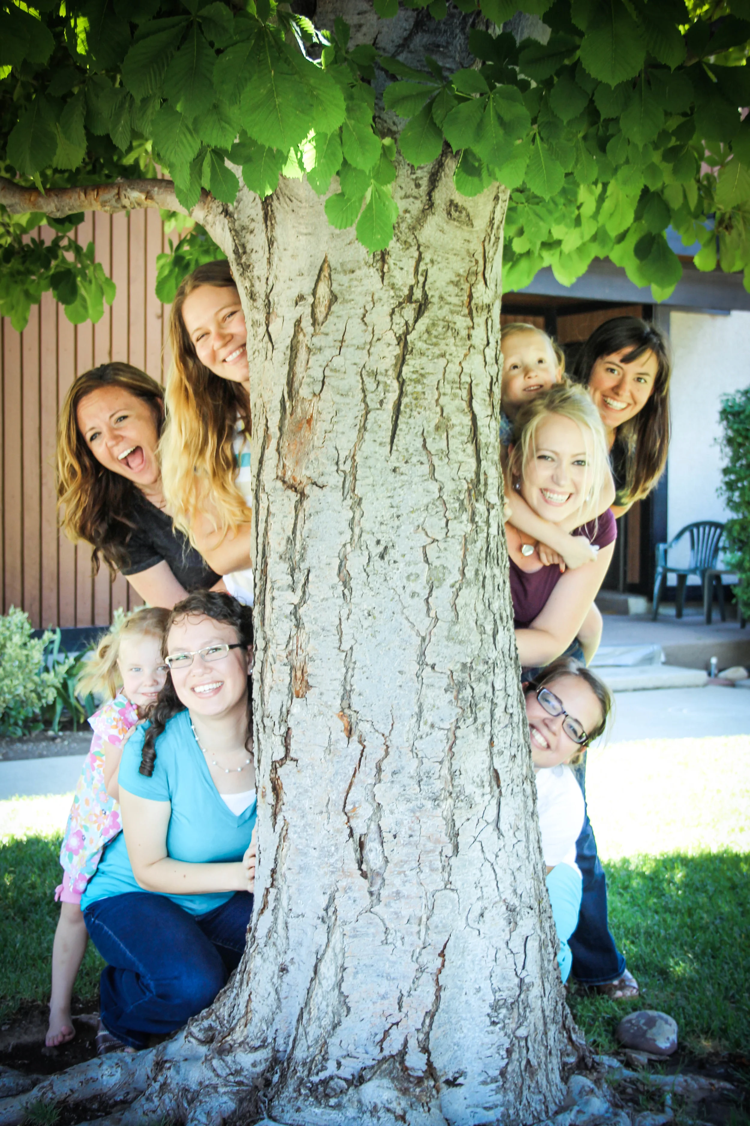 See how much fun we are? All piled behind that tree the way we are?