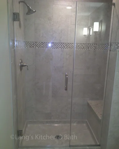 Bathroom design featuring a low threshold shower and a built-in bench.