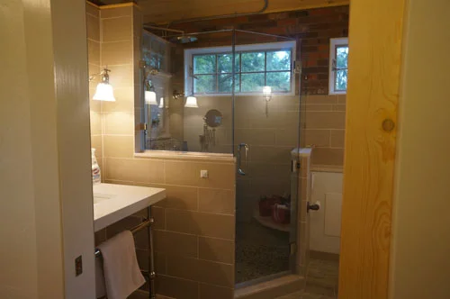 Exposed brick provides a cooling, industrial look to any bathroom!