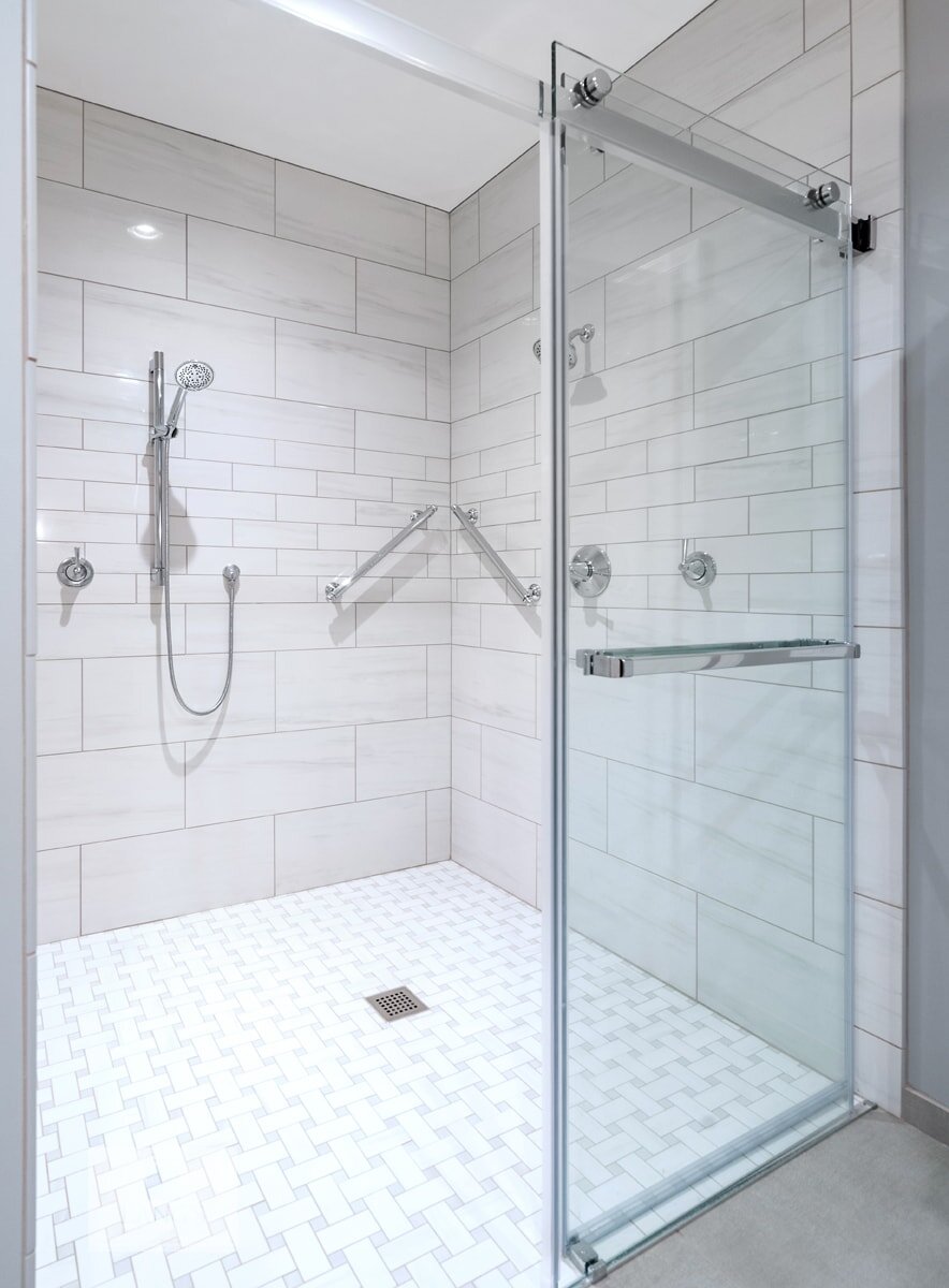 large shower design with grab bars