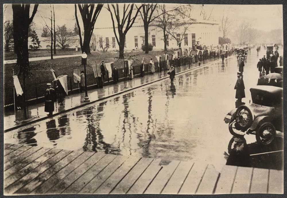 Suffrage pickets marching around the White House-- March 4, 1917