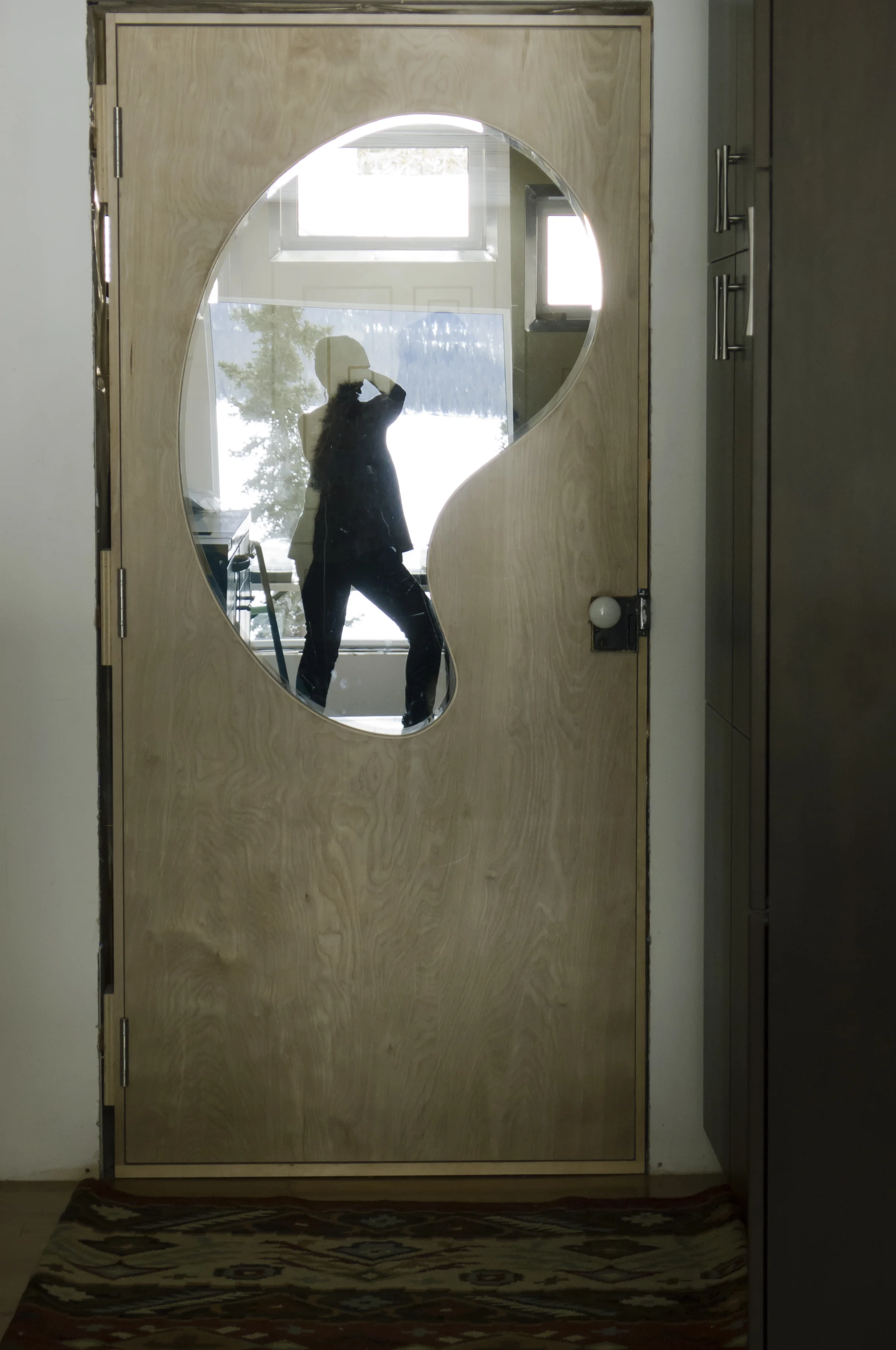 Interior door of arctic entrance. I love the refection of the lake from behind, being in front.