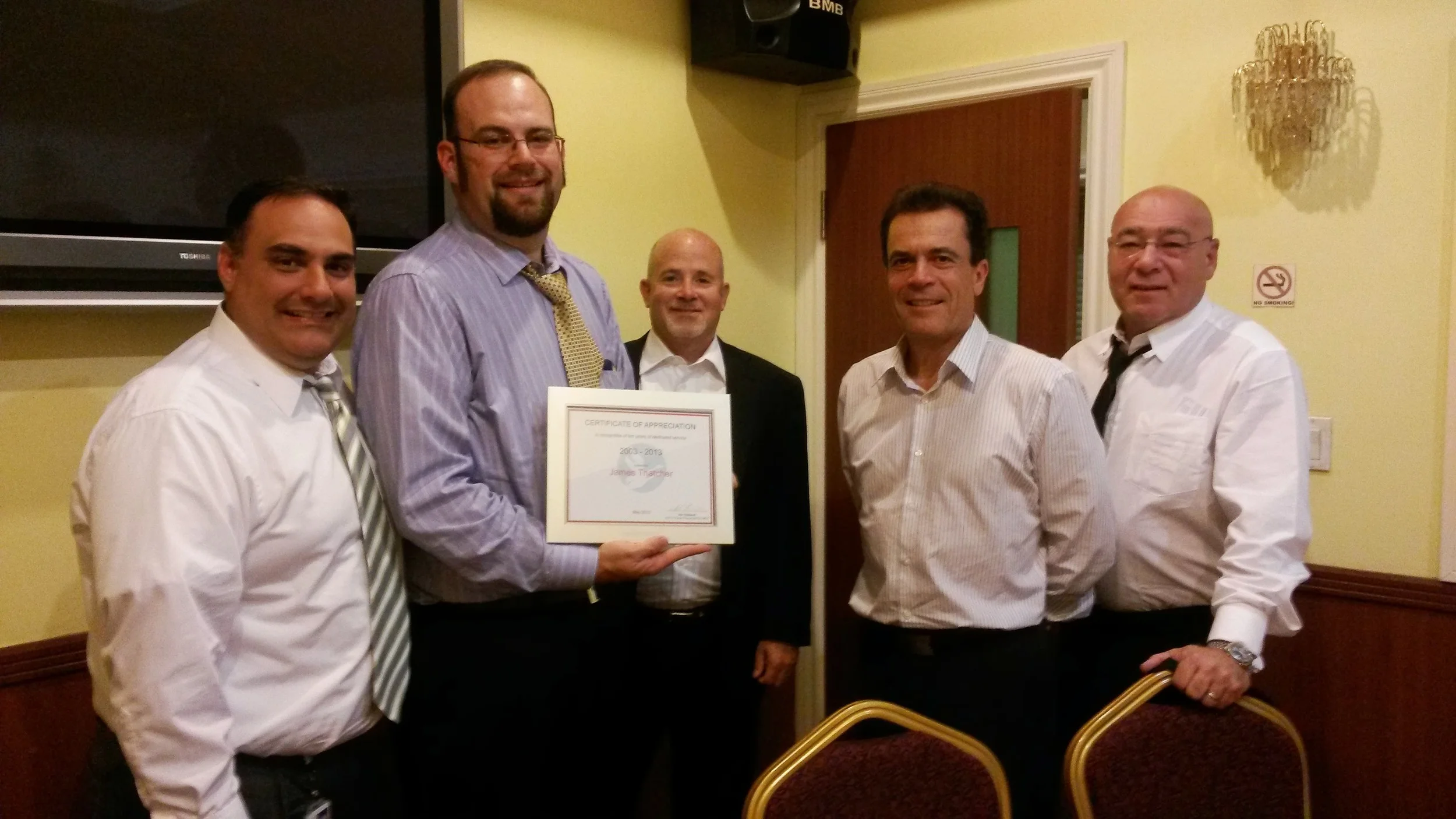 In August 2013, I was presented with a Certificate of Appriciation for my ten years of service with Hellmann Worldwide Logistics . ( I actually had my ten year point in May, but it's still a very nice gesture .) In the picture (from left to right are: Mark Sola (VP Import Trade Compliance and Brokerage Services - Hellmann US), me, Chuck Pyatte (Regional Vice President: Western Region - Hellmann US), Roger Haeussler (Global Operations Manager - Hellmann Worldwide), and Arnold Goldstein (Chief Operations Officer - Hellmann US) 
