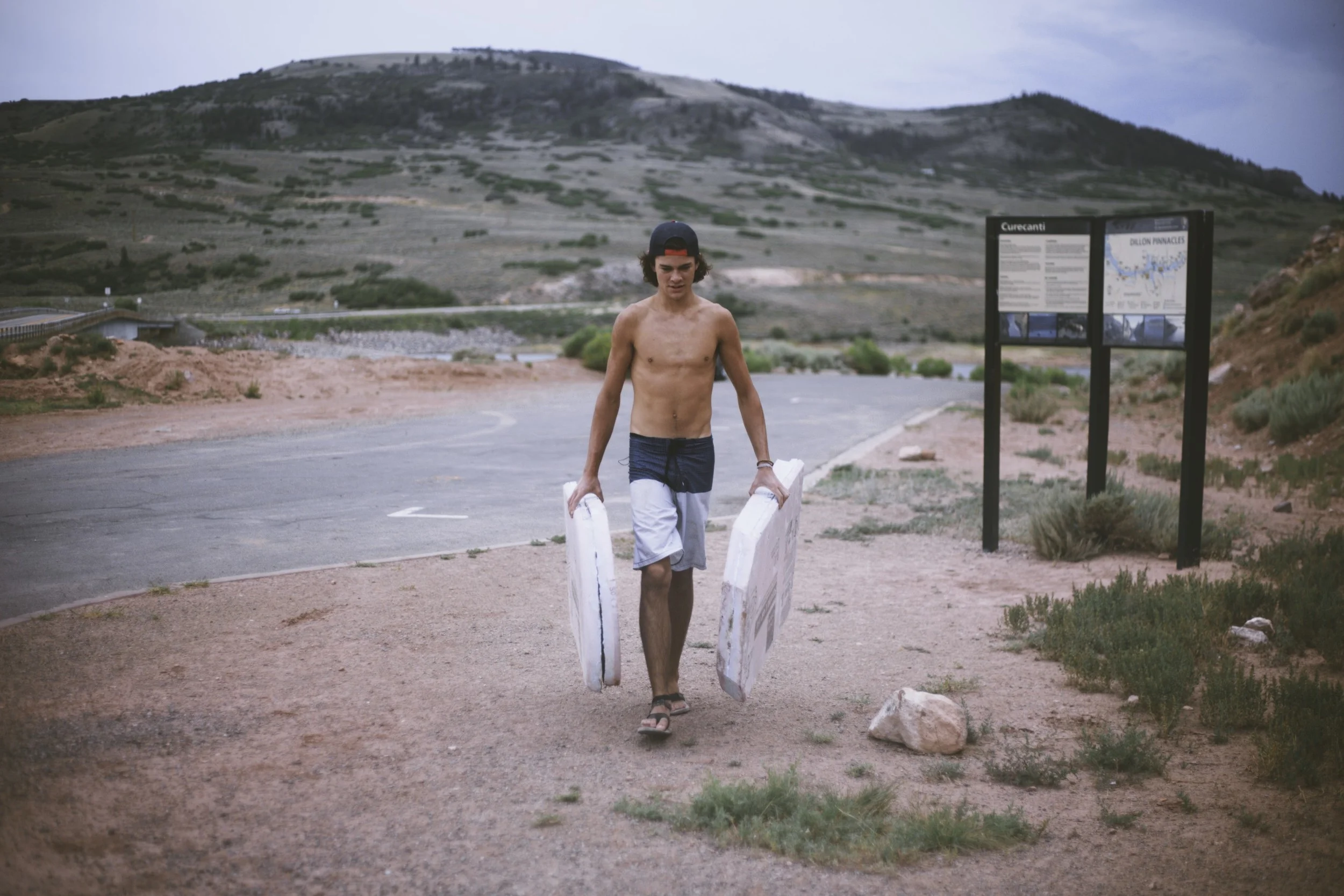 Luke with the remains of his paddle board. 