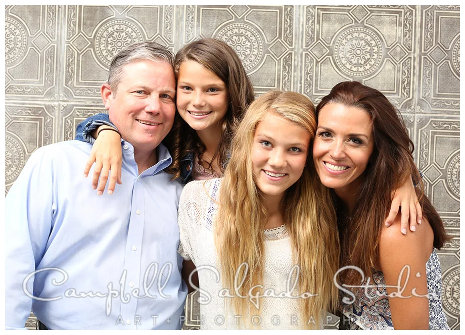 Portrait of family on vintage tile background by Campbell Salgado Studio.