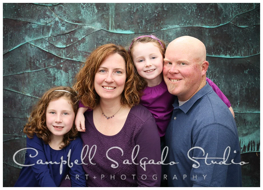 Portrait of family on copper background at Campbell Salgado Studio in Portland, Oregon.
