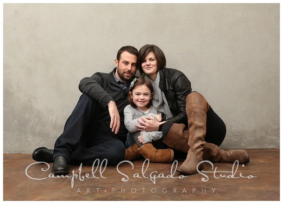 Portrait of family on grey background at Campbell Salgado Studio.