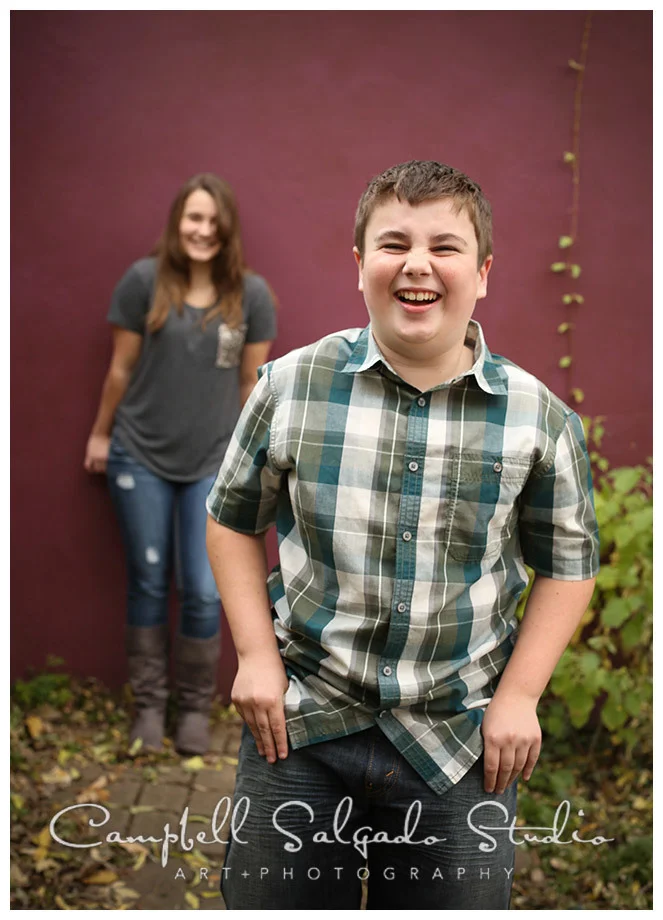 Portrait of siblings on plum background by photographers Campbell and Salgado.