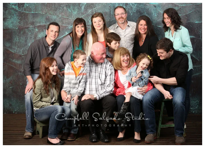 Portrait of extended family on copper background at Campbell Salgado Studio.