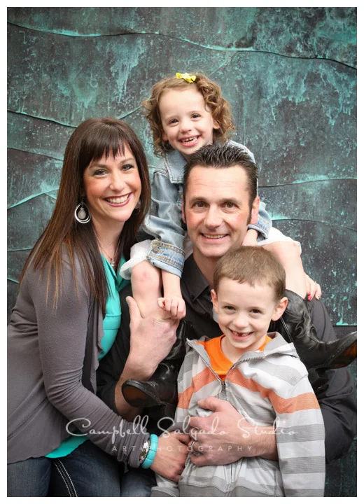 Portrait of family on copper background at Campbell Salgado Studio.