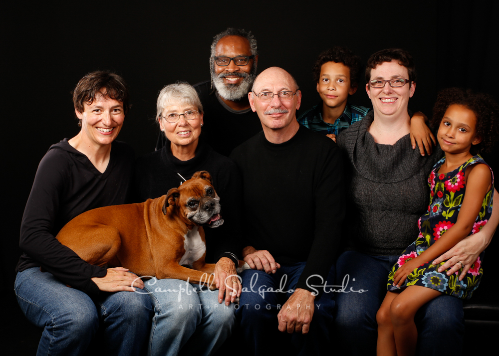  Portrait of multi generational family on black background by family photographers at Campbell Salgado Studio, Portland, Oregon 
