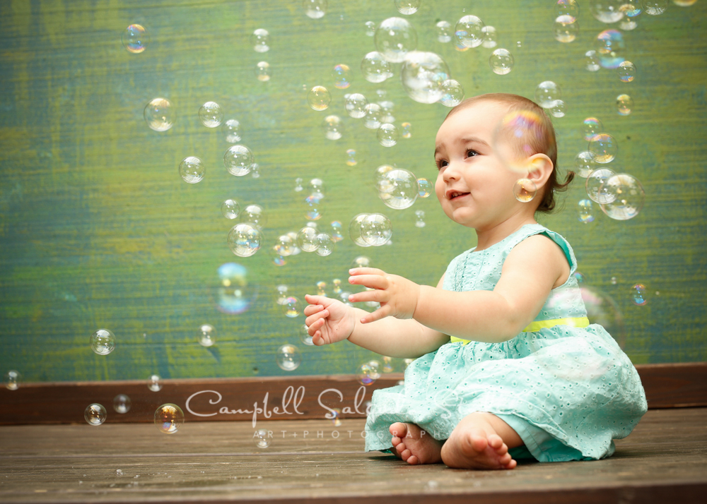  Portrait of baby girl on green weave background&nbsp;by child photographers at Campbell Salgado Studio, Portland, Oregon. 