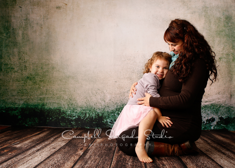  Portrait of pregnant mother and daughter on abandoned concrete background&nbsp;by family photographers at Campbell Salgado Studio, Portland, Oregon. 