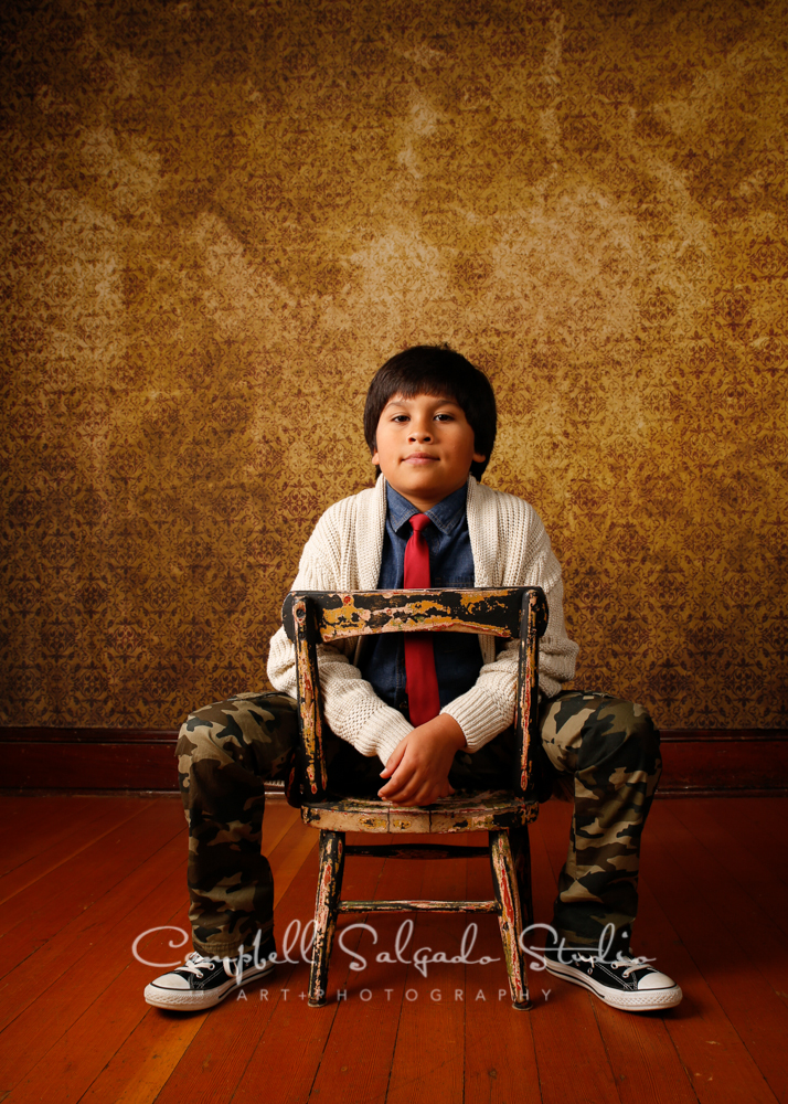  Portrait of boy on amber light background&nbsp;by child photographers at Campbell Salgado Studio, Portland, Oregon. 
