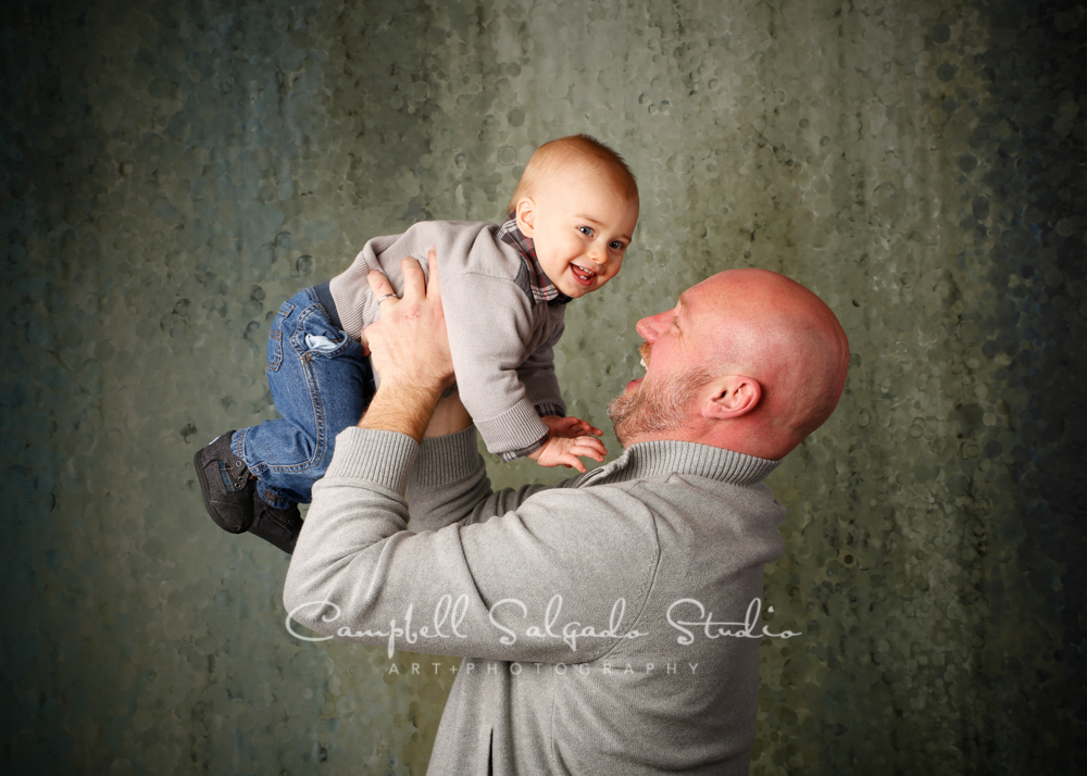  Portrait of father and son on rain dance background&nbsp;by family photographers at Campbell Salgado Studio, Portland, Oregon. 
