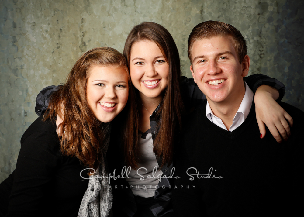  Portrait of siblings on rain dance background by family photographers at Campbell Salgado Studio, Portland, Oregon. 