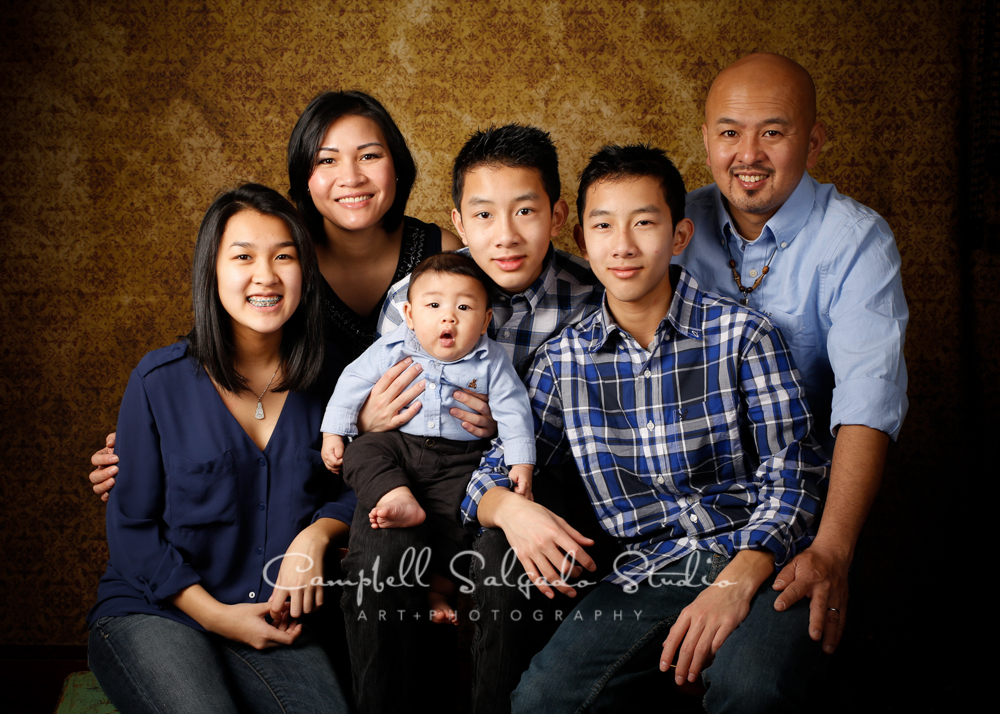  Portrait of family on amber light background&nbsp;by family photographers at Campbell Salgado Studio, Portland, Oregon. 