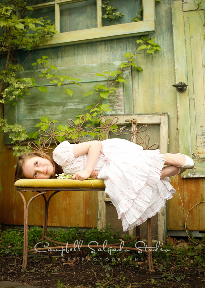  Portrait of child on vintage doors background&nbsp;by childrens photographers at Campbell Salgado Studio, Portland, Oregon. 