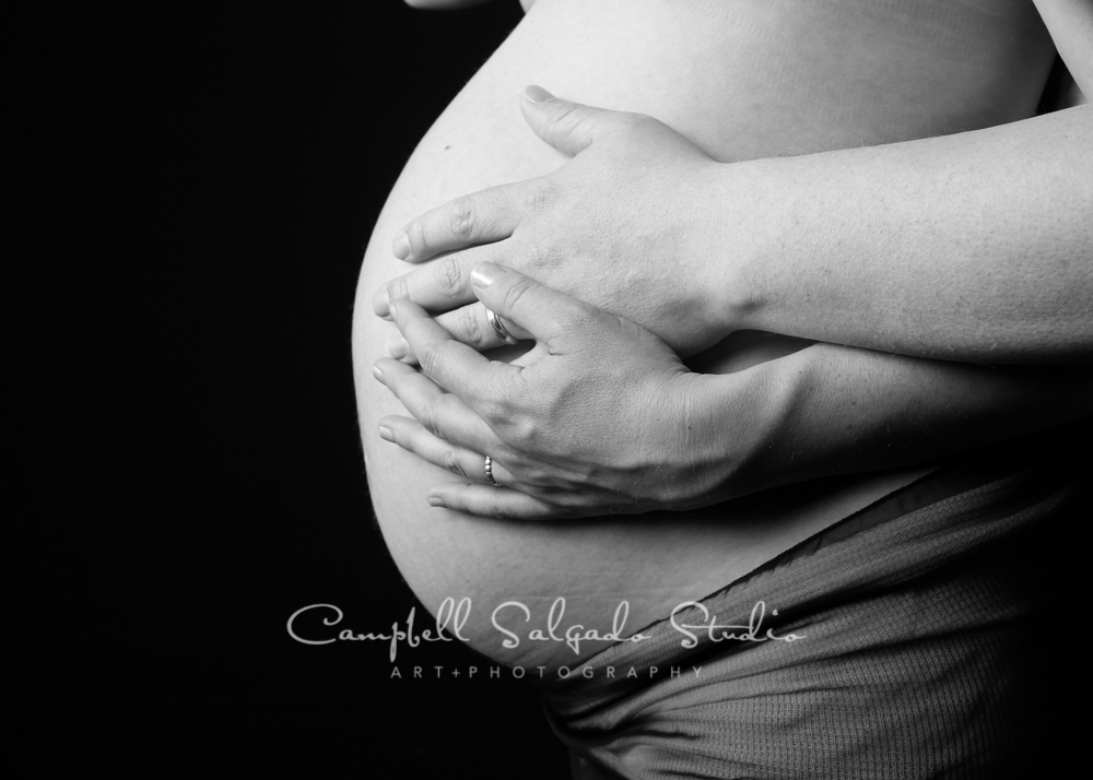  B&amp;W portrait of pregnant belly on black background&nbsp;by maternity&nbsp;photographers at Campbell Salgado Studio, Portland, Oregon. 