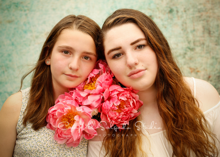  Portrait of sisters on weathered green background&nbsp;by family photographers at Campbell Salgado Studio, Portland, Oregon. 
