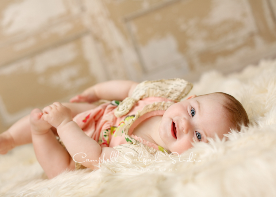  Portrait of baby&nbsp;on antique ivory doors background&nbsp;by childrens photographers at Campbell Salgado Studio, Portland, Oregon. 