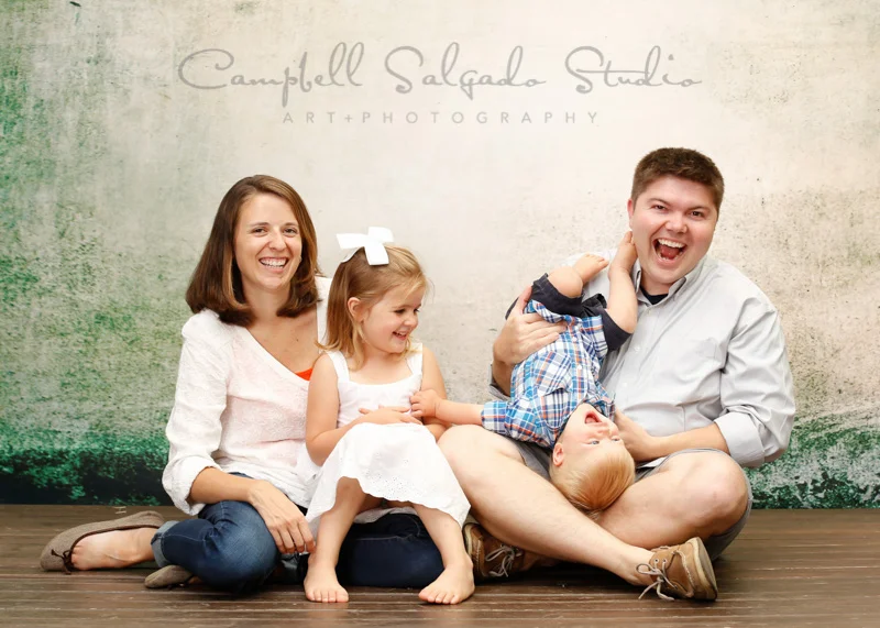 Portrait of a happy family by family photographers at Campbell Salgado Studio, Portland, Oregon