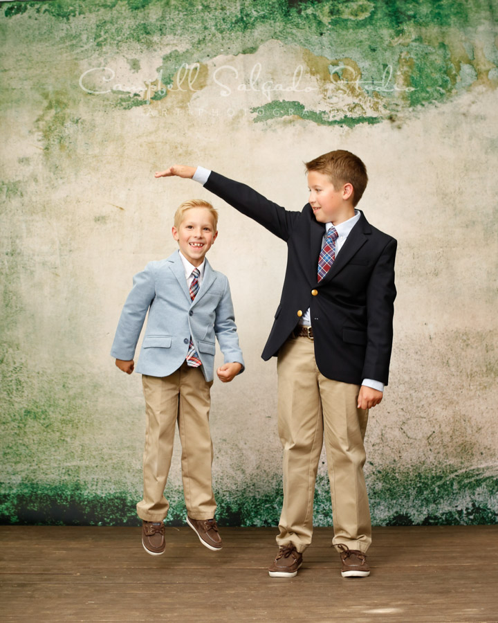  Portrait of brothers on abandoned concrete background by child photographers at Campbell Salgado Studio in Portland, Oregon. 