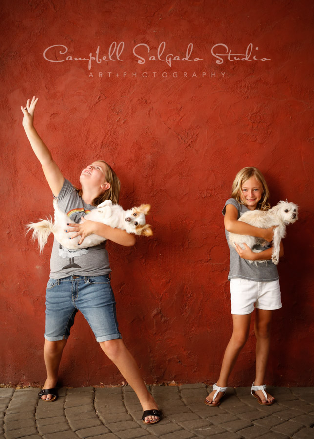  Portrait of kids on red stucco background by childrens photographers at Campbell Salgado Studio in Portland, Oregon. 