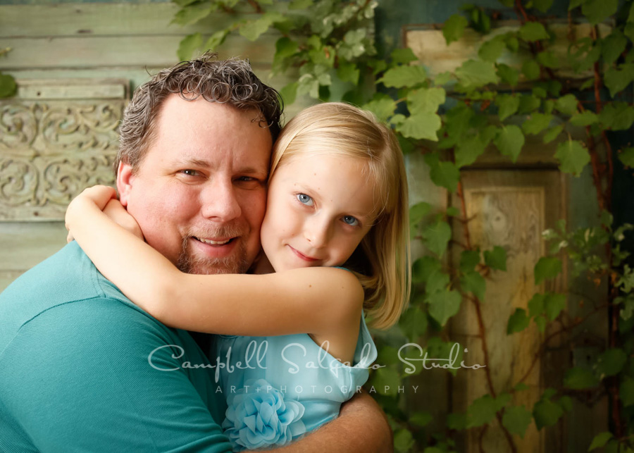  Portrait of father and daughter&nbsp;on vintage green doors background by family photographers at Campbell Salgado Studio in Portland, Oregon. 