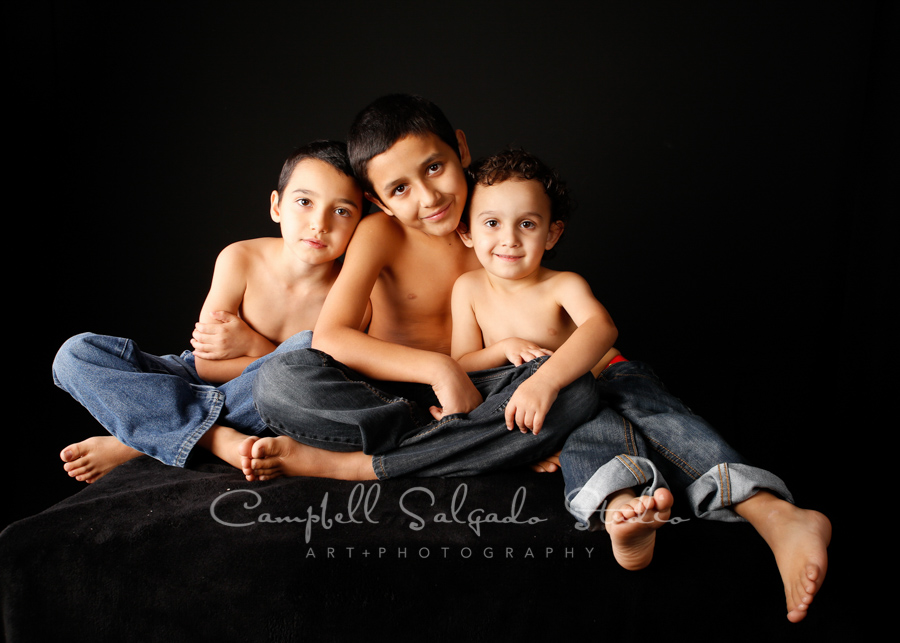  Portrait of kids on black background by children's photographers at Campbell Salgado Studio in Portland, Oregon. 