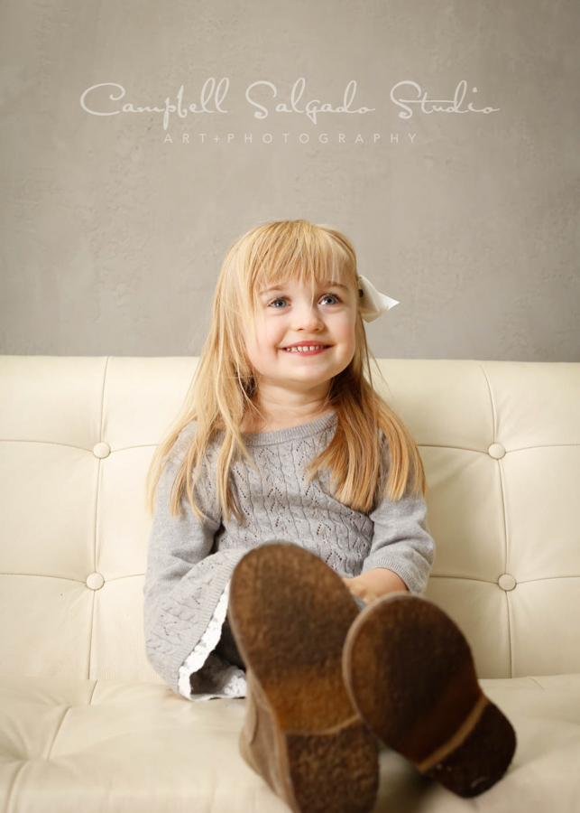  Portrait of child on modern grey background by child photographers at Campbell Salgado Studio in Portland, Oregon. 