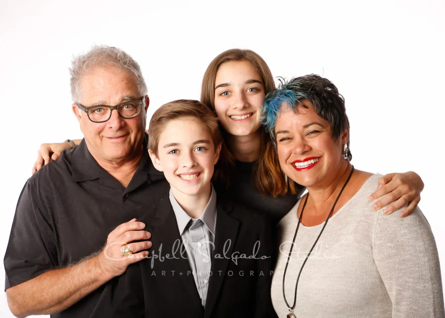 Portrait of family on white background by family photographers at Campbell Salgado Studio in Portland, Oregon.
