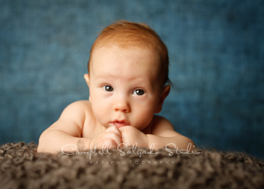  Portrait of baby on denim background by baby photographers at Campbell Salgado Studio in Portland, Oregon. 