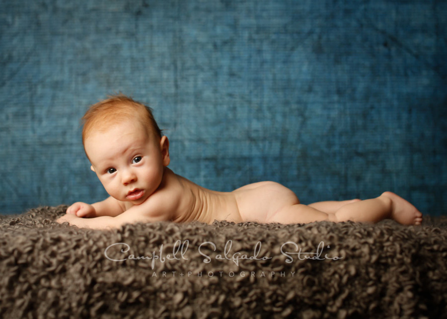  Portrait of baby on denim background by baby photographers at Campbell Salgado Studio in Portland, Oregon. 