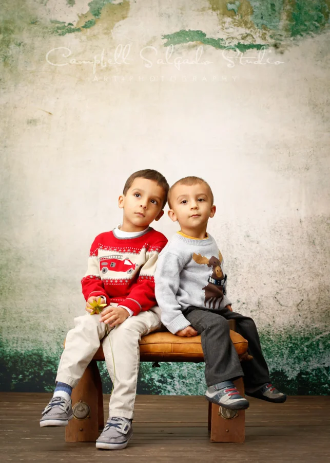 Portrait of children on abandoned concrete background by child photographers at Campbell Salgado Studio in Portland, Oregon.
