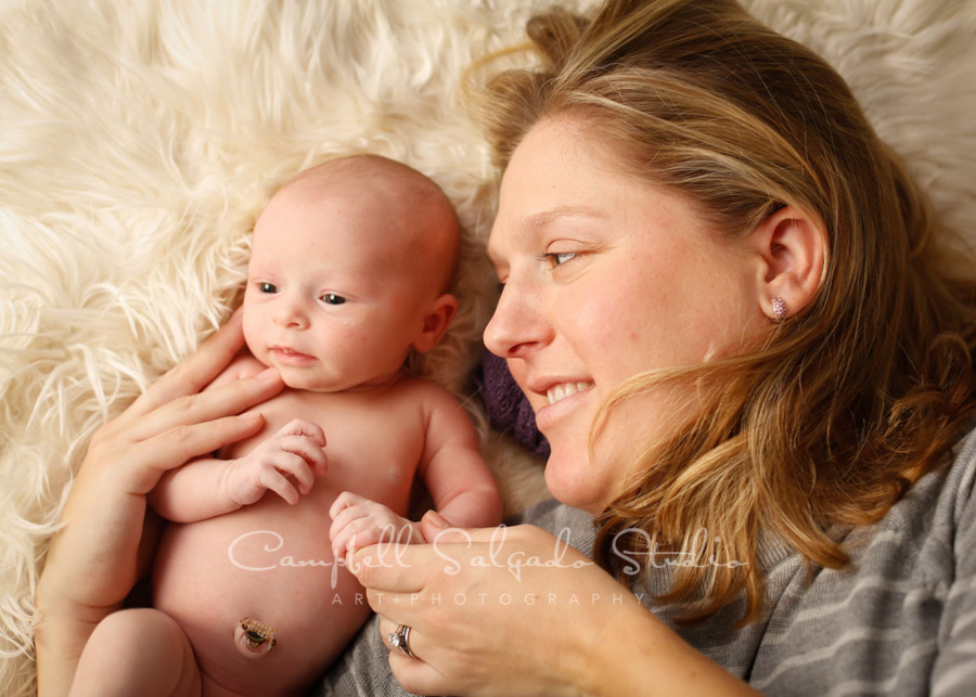  Portrait of mother and baby on blankie background by newborn photographers at Campbell Salgado Studio in Portland, Oregon. 