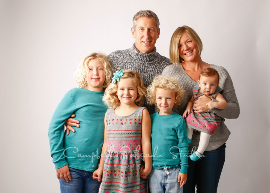  Portrait of family on white background by family photographers at Campbell Salgado Studio in Portland, Oregon. 