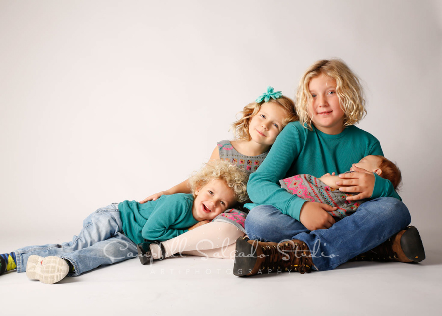  Portrait of children on white background by children's photographers at Campbell Salgado Studio in Portland, Oregon. 