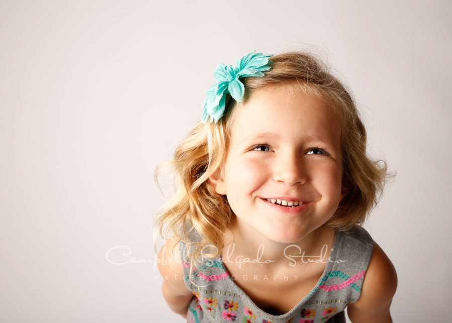  Portrait of girl on white background by child photographers at Campbell Salgado Studio in Portland, Oregon. 