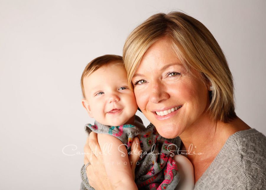  Portrait of mother and baby on white background by infant photographers at Campbell Salgado Studio in Portland, Oregon. 