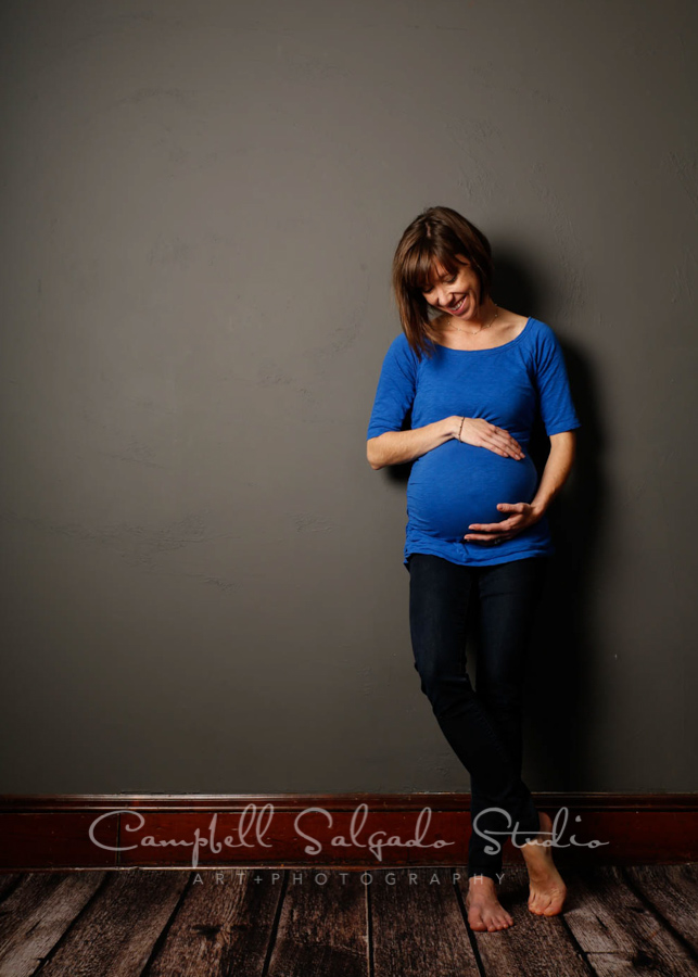  Portrait of woman on grey background by maternity photographers at Campbell Salgado Studio in Portland, Oregon. 