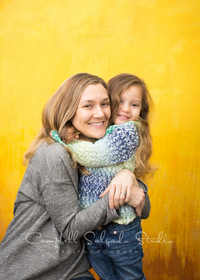  Portrait of little girl and mom on liquid sunshine background by family photographers at Campbell Salgado Studio in Portland, Oregon. 