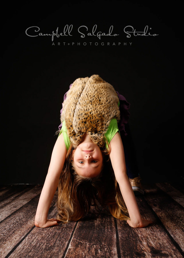  Portrait of girl on black background by child photographers at Campbell Salgado Studio in Portland, Oregon. 