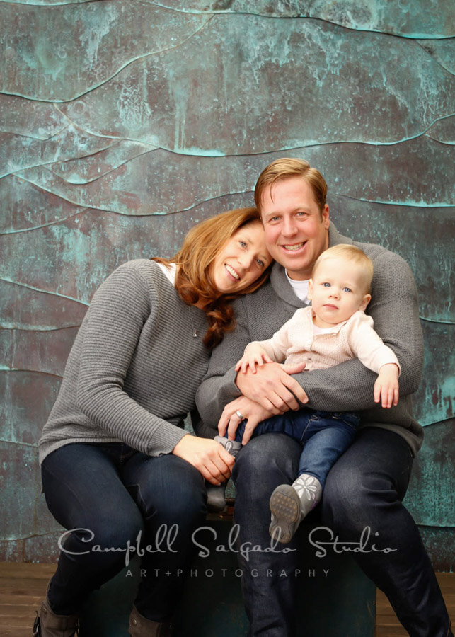  Portrait of family on copper wave background by family photographers at Campbell Salgado Studio in Portland, Oregon. 