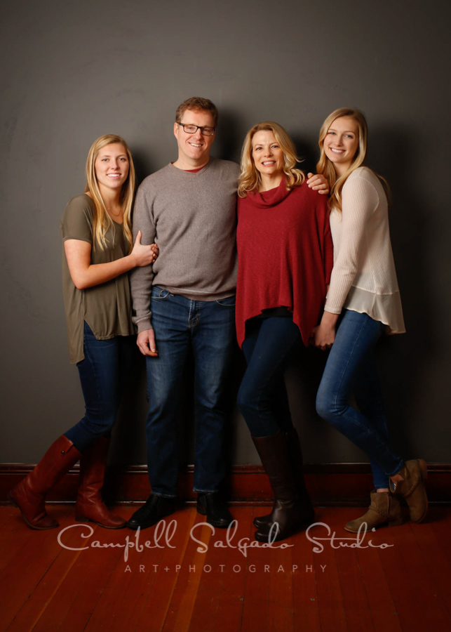  Portrait of family on gray background by family photographers at Campbell Salgado Studio in Portland, Oregon. 