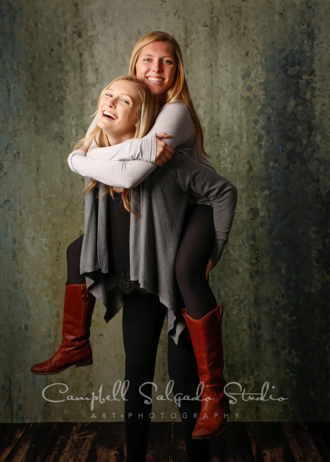  Portrait of sisters on rain dance background by family photographers at Campbell Salgado Studio in Portland, Oregon. 