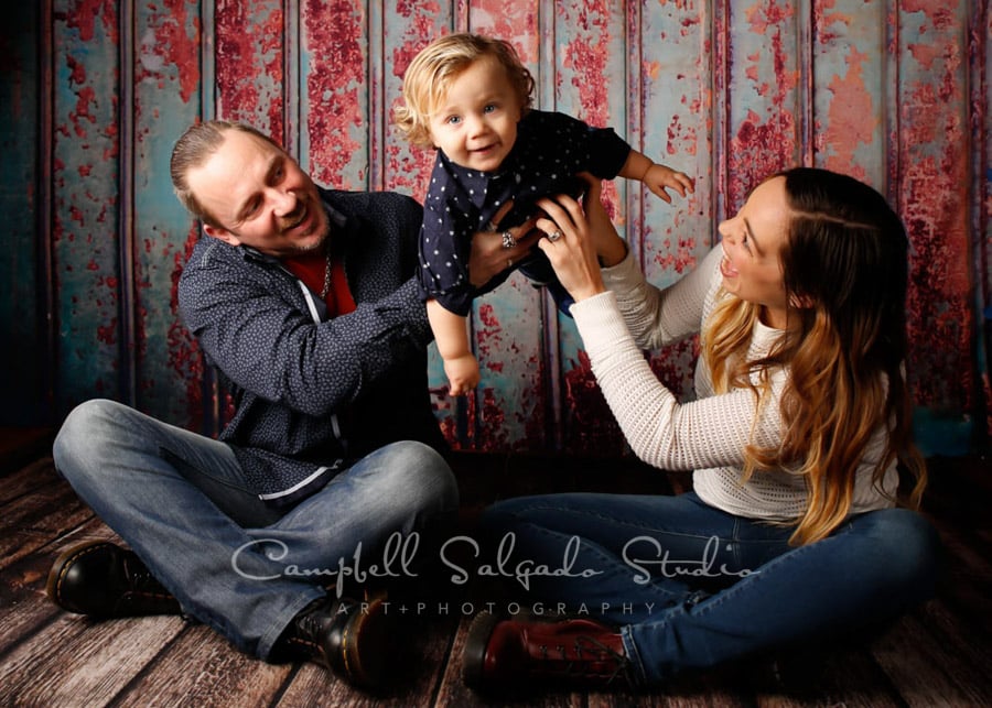  Portrait of family on Italian rust background by family photographers at Campbell Salgado Studio in Portland, Oregon. 