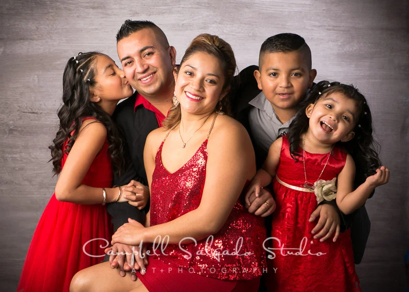 Family photography of a smiling family of 5 at Campbell Salgado Studio in Portland, Oregon.