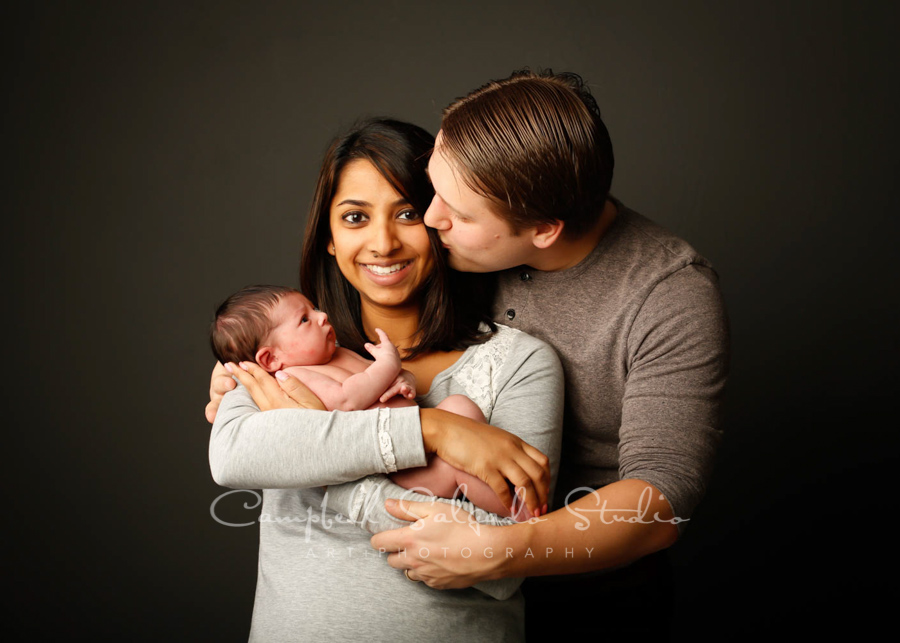  Portrait of family on gray background by family photographers at Campbell Salgado Studio in Portland, Oregon. 